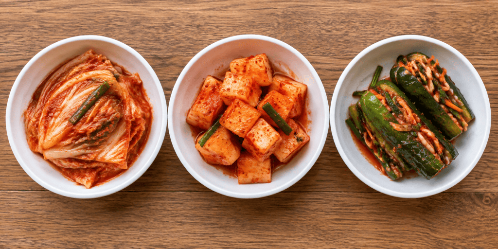 Three types of Korean kimchi: cabbage, radish, and cucumber